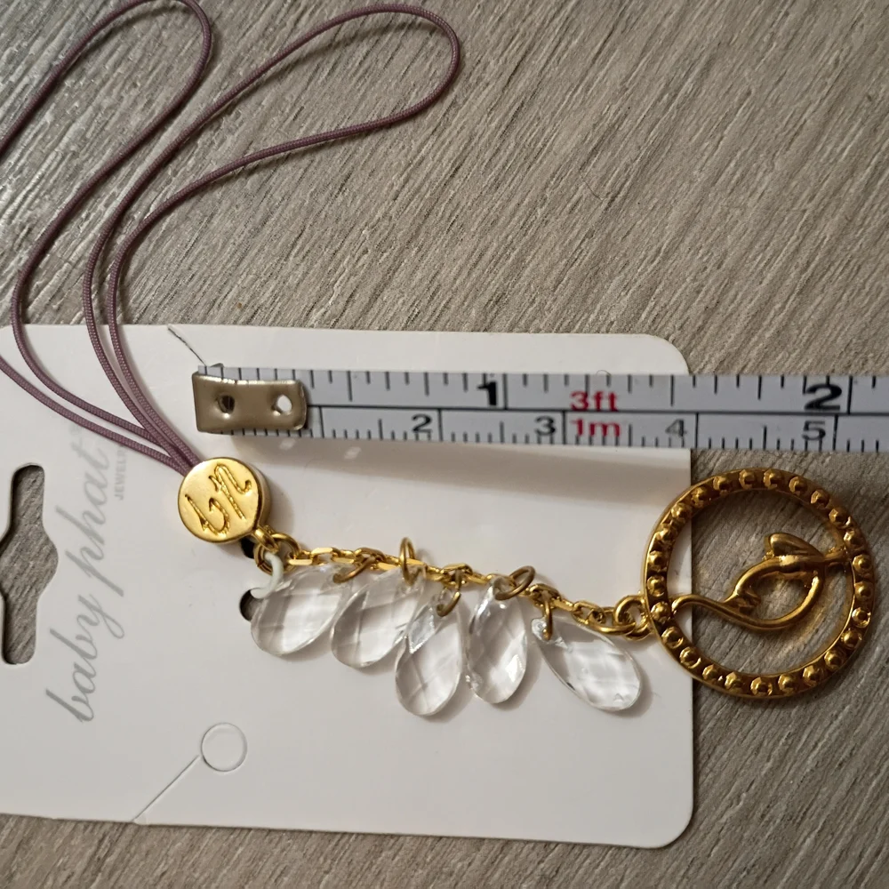 Baby Phat Gold Charm Phone Strap with Clear Crystal Drops and Mauve Cords